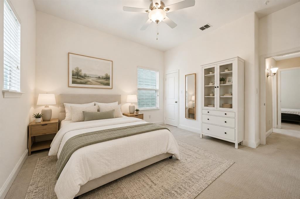 773 South Coppell Road Coppell, TX 75019 - Photo 22 of 30 a spacious bedroom with a large bed and a window