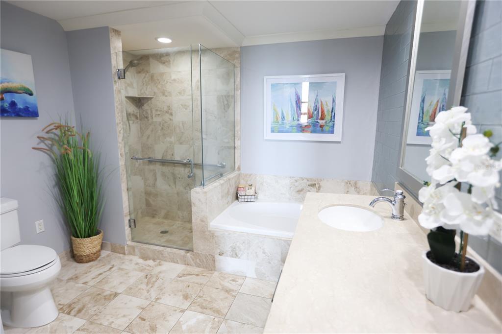 1350 Main Street, Unit 709 Sarasota, FL 34236 - Photo 21 of 56 a bathroom with a sink mirror and toilet
