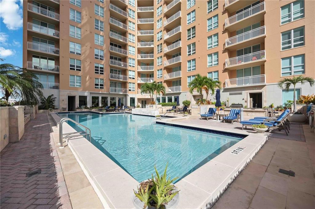 1350 Main Street, Unit 709 Sarasota, FL 34236 - Photo 37 of 56 a view of building with swimming pool and sitting area