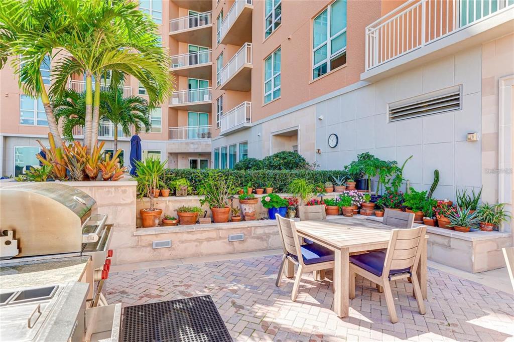1350 Main Street, Unit 709 Sarasota, FL 34236 - Photo 39 of 56 a view of a chairs and table in a patio
