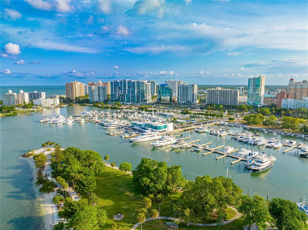 1350 Main Street, Unit 709 Sarasota, FL 34236 - Photo 52 of 56 a view of a lake with a city