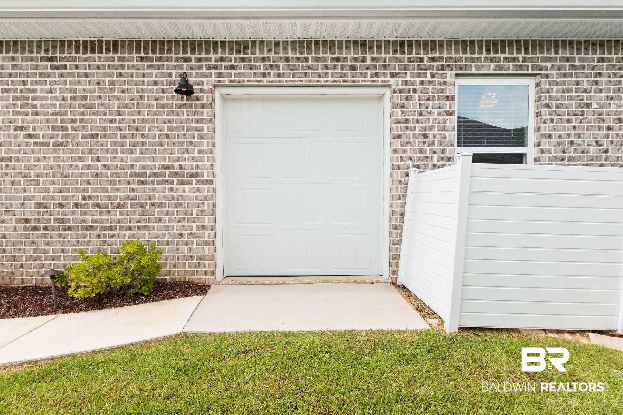 9815 Lakeview Drive Foley, AL 36535 - Photo 64 of 100 Golf Cart Garage entry on side of house