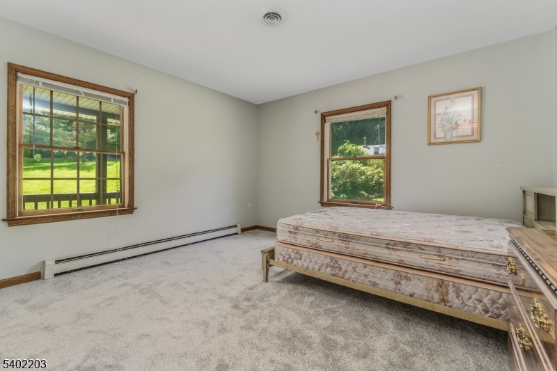 20 South Polktown Road Hampton, NJ 08827 - Photo 25 of 44 a bed sitting in a bedroom next to a window