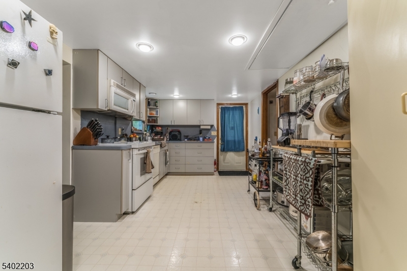 20 South Polktown Road Hampton, NJ 08827 - Photo 5 of 44 a kitchen with white cabinets and white appliances