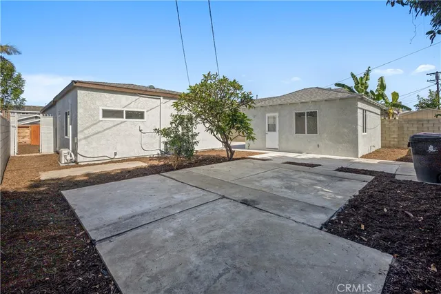a aerial view of a house with a yard