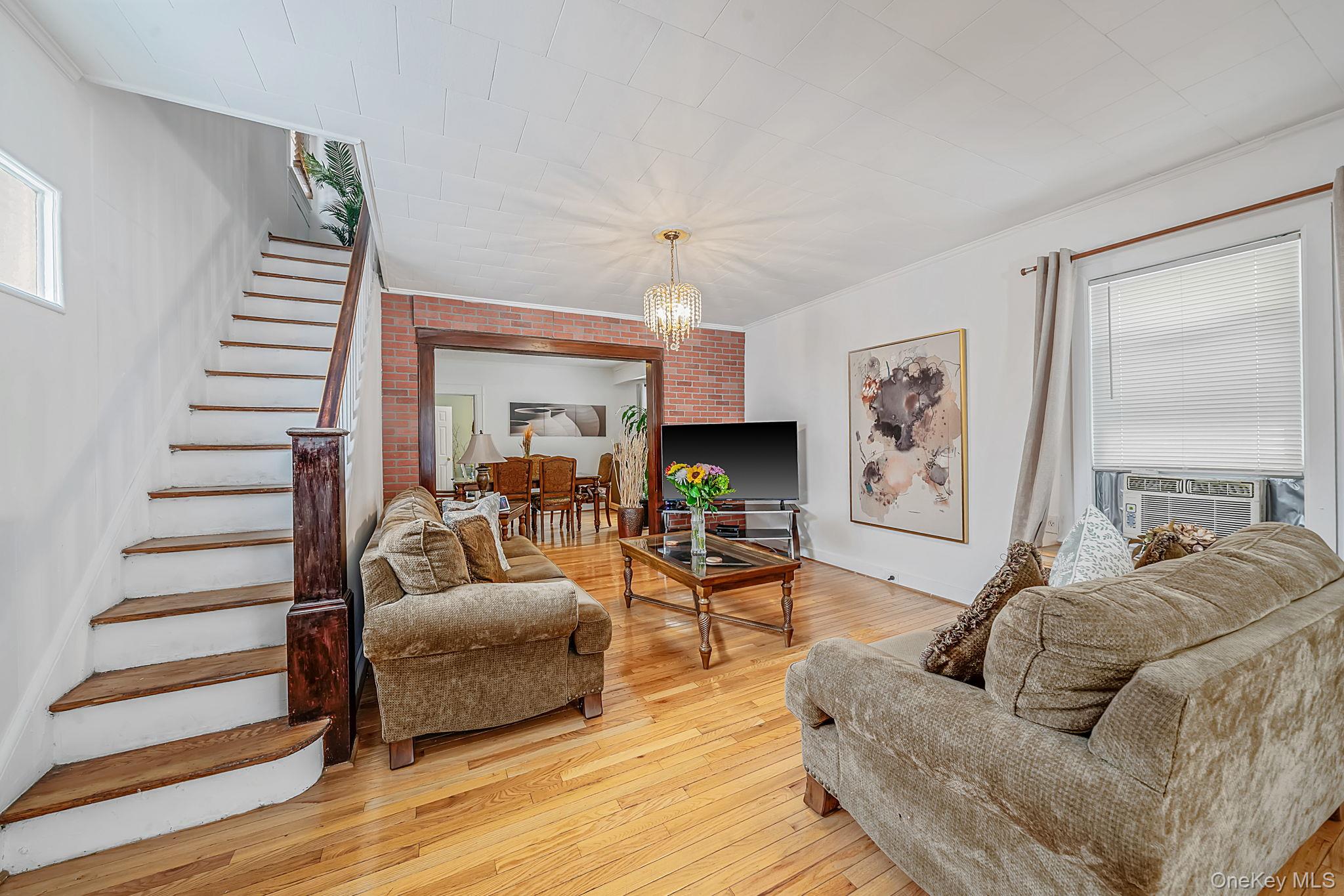 93-20 92nd Avenue Queens, NY 11421 - Photo 5 of 21 a living room with furniture and a wooden floor