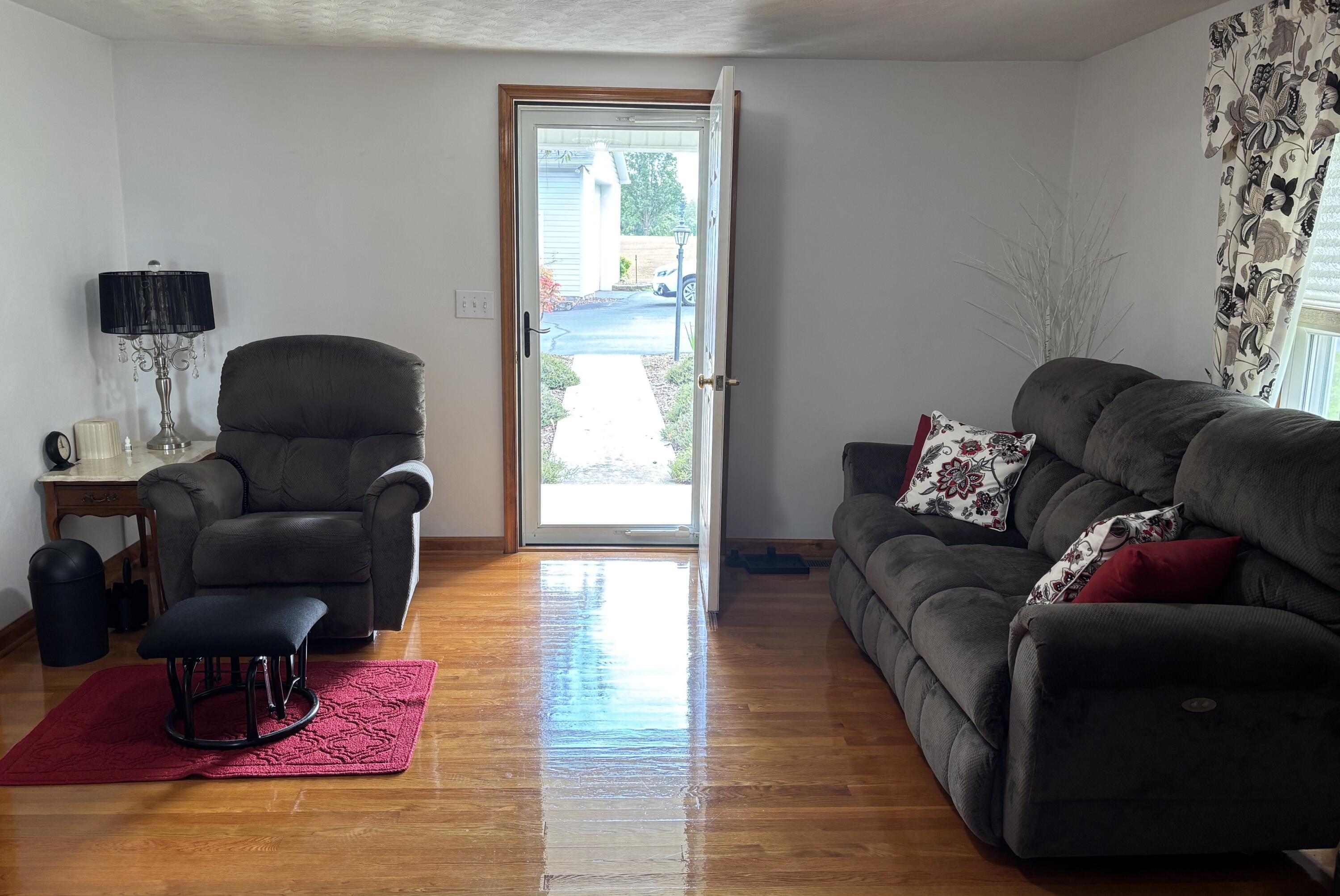 1235 Rock Spring Road Goodview, VA 24095 - Photo 12 of 62 a living room with furniture and wooden floor
