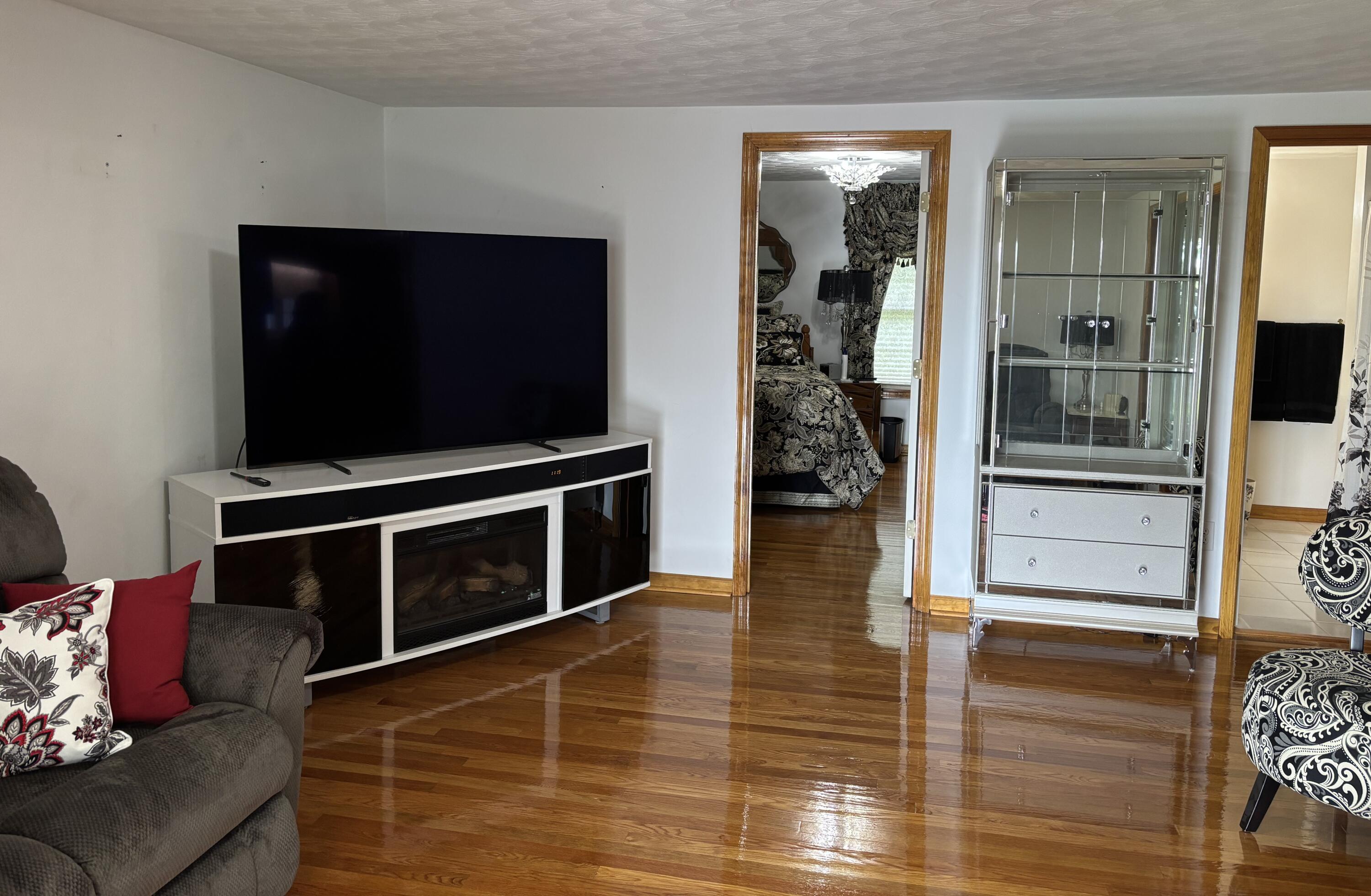 1235 Rock Spring Road Goodview, VA 24095 - Photo 13 of 62 a living room with furniture and a flat screen tv