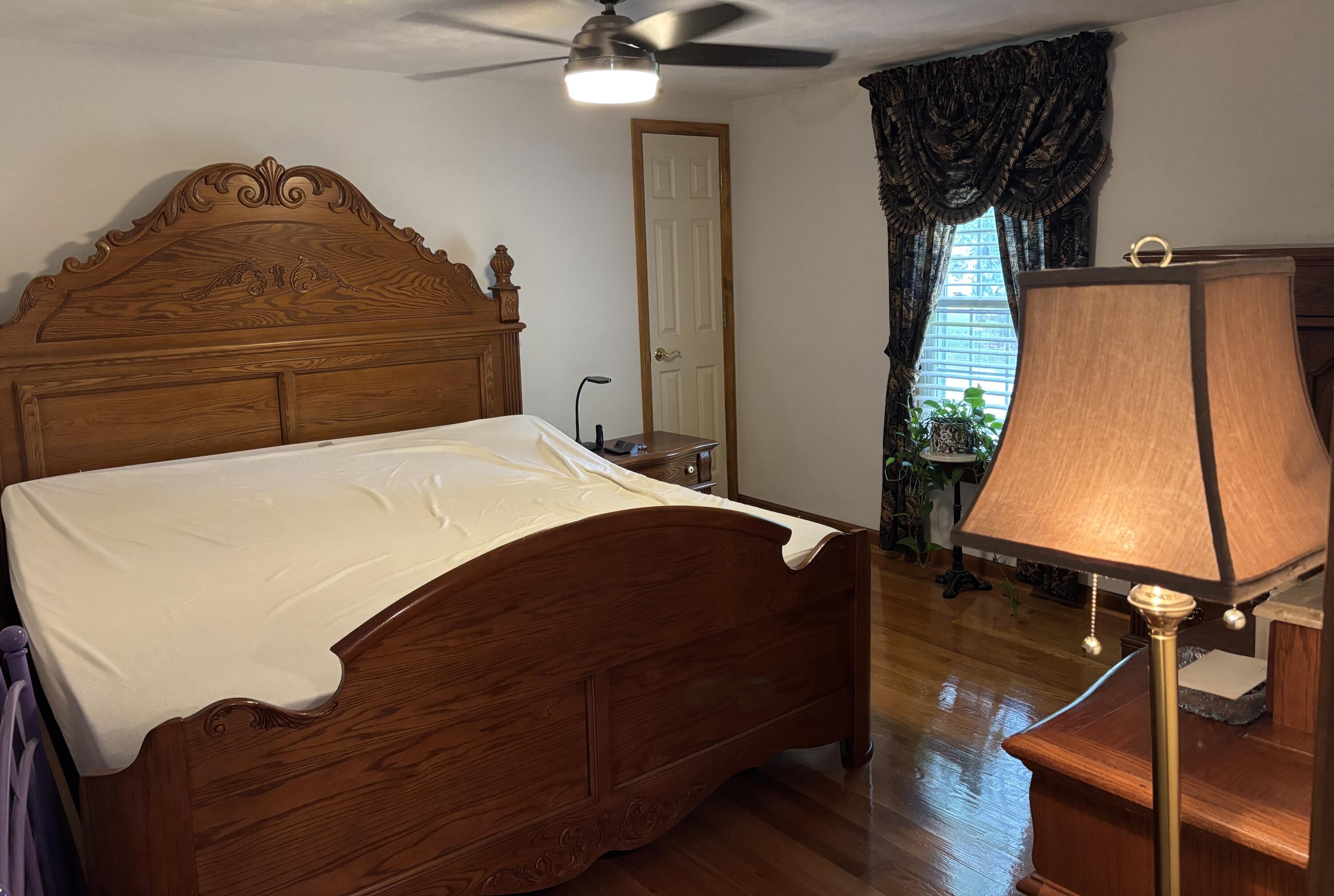 1235 Rock Spring Road Goodview, VA 24095 - Photo 27 of 62 a bedroom with a bed and a dresser
