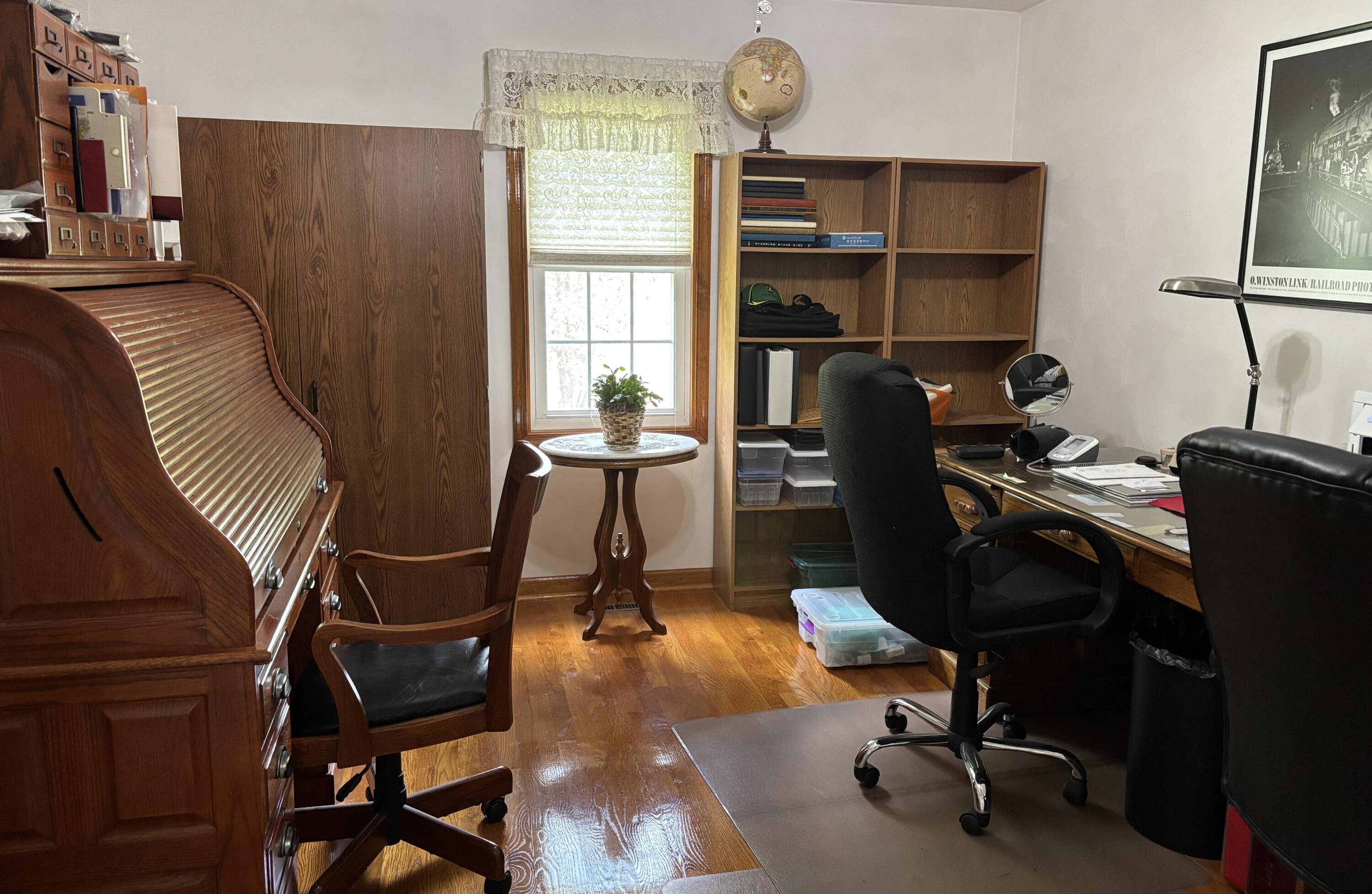 1235 Rock Spring Road Goodview, VA 24095 - Photo 29 of 62 a view of a workspace with furniture and a window
