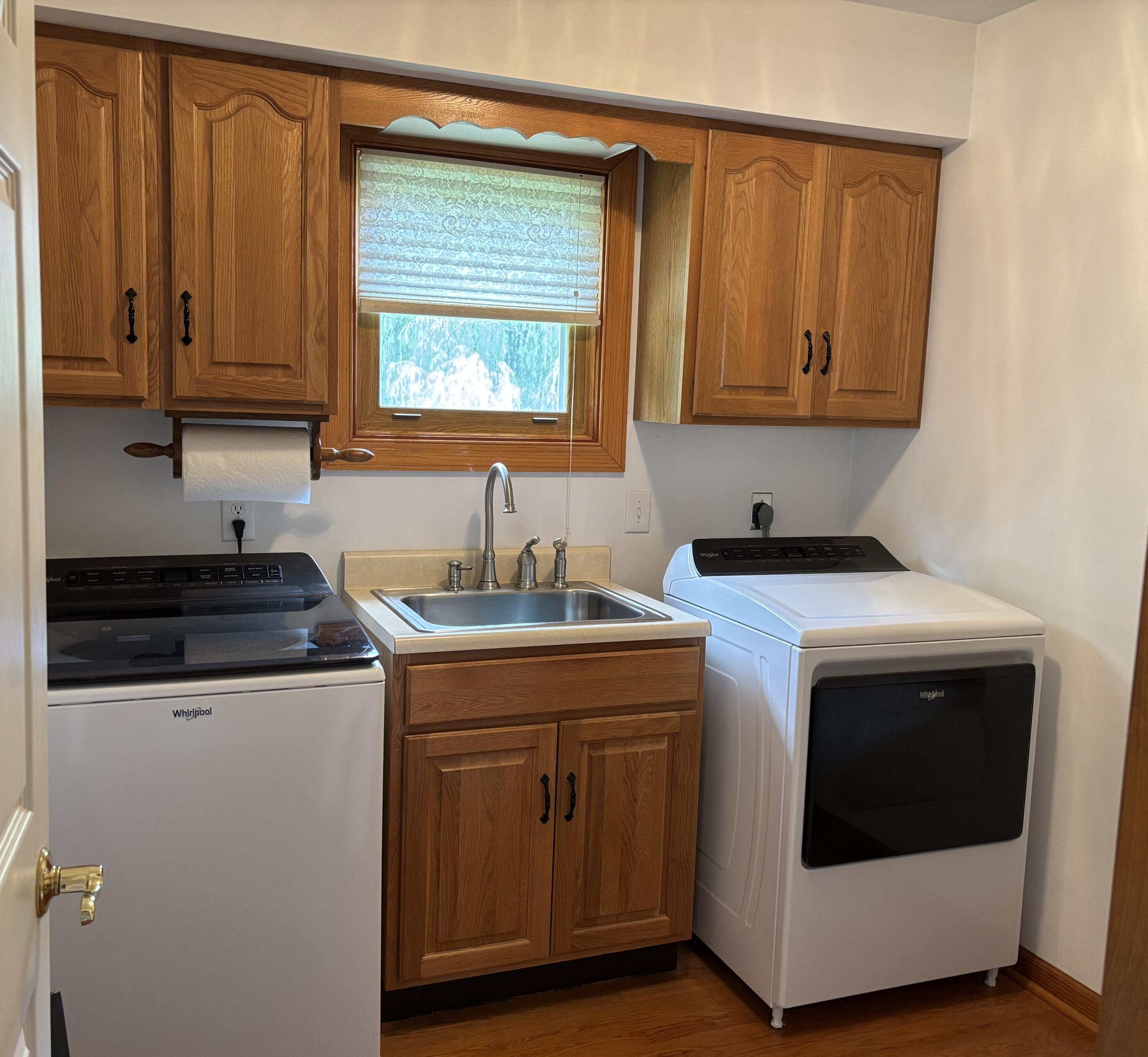 1235 Rock Spring Road Goodview, VA 24095 - Photo 30 of 62 a kitchen with stainless steel appliances granite countertop a stove and a microwave
