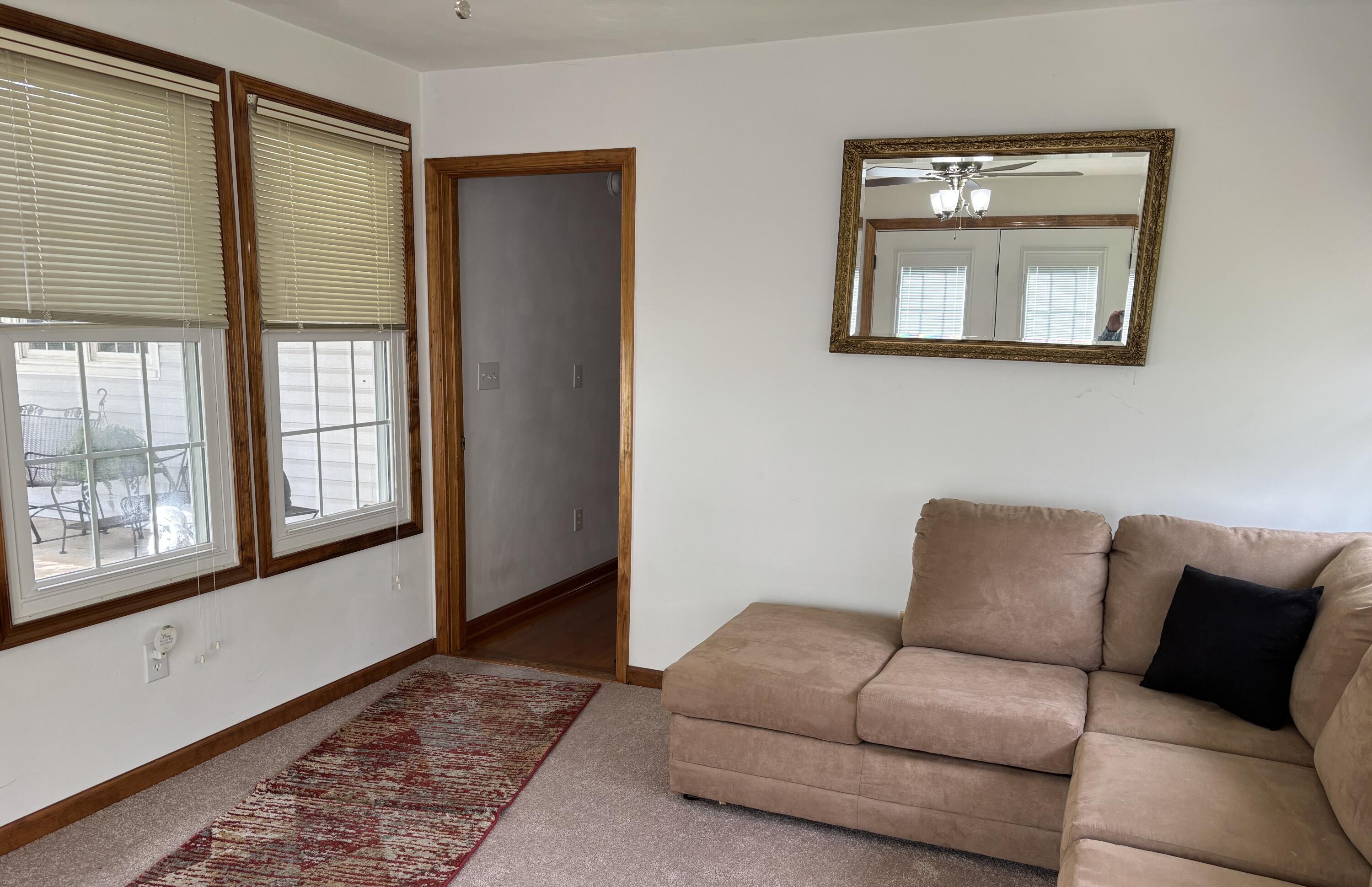 1235 Rock Spring Road Goodview, VA 24095 - Photo 33 of 62 a living room with furniture and a window