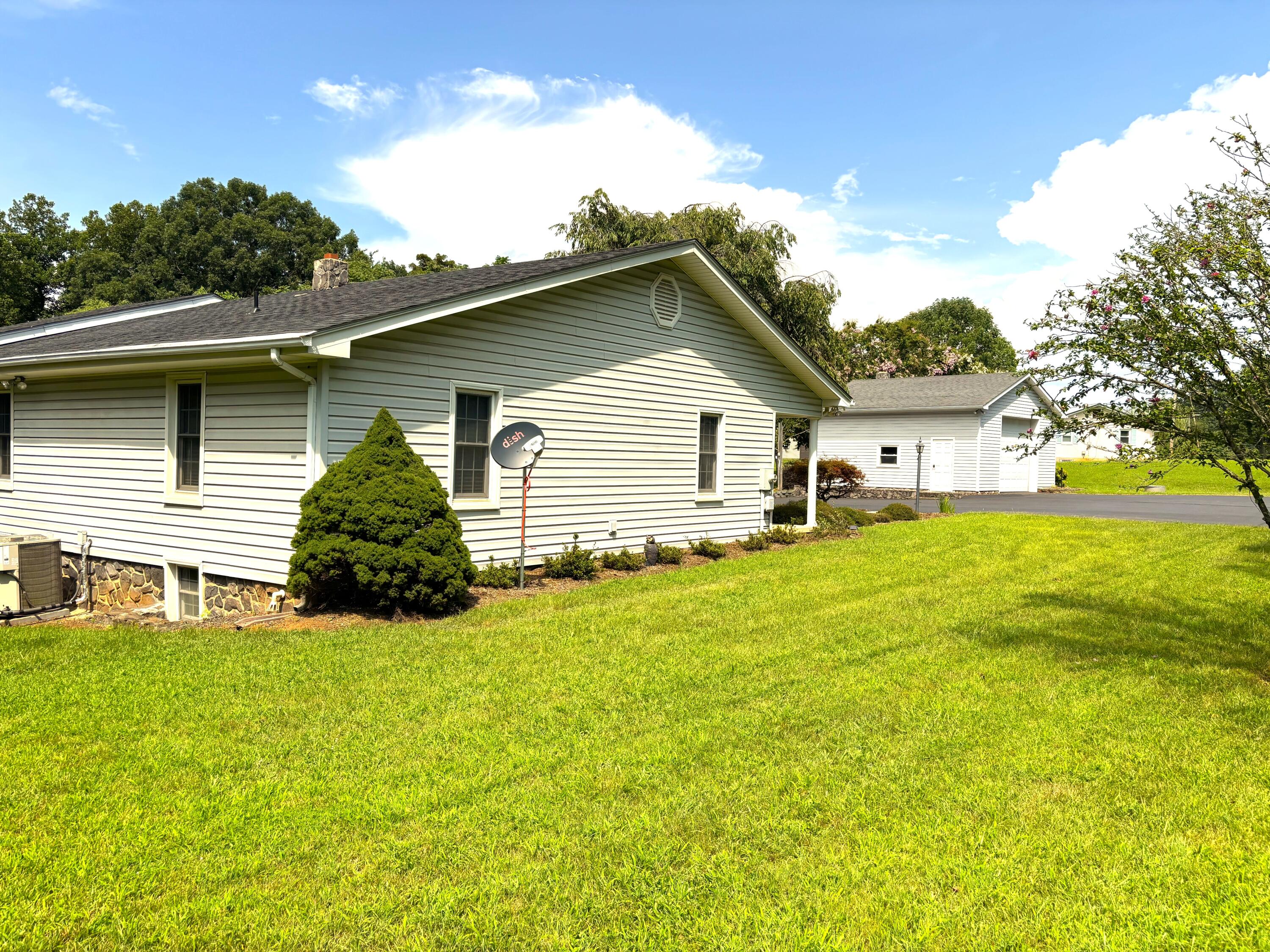 1235 Rock Spring Road Goodview, VA 24095 - Photo 10 of 62 a view of a house with a yard