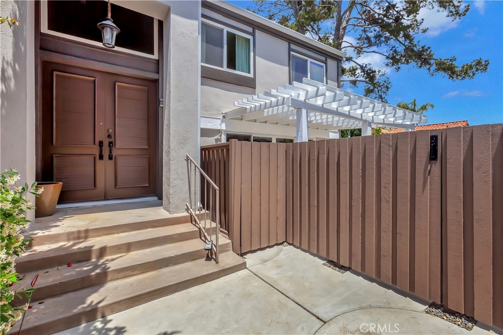 4625 Green Tree Lane Irvine, CA 92612 - Photo 2 of 29 a view of a house with a wooden fence