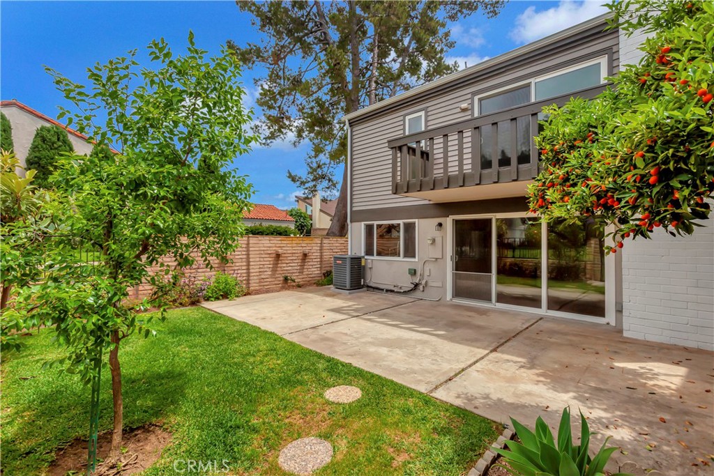 4625 Green Tree Lane Irvine, CA 92612 - Photo 21 of 29 a house with a tree in front of it
