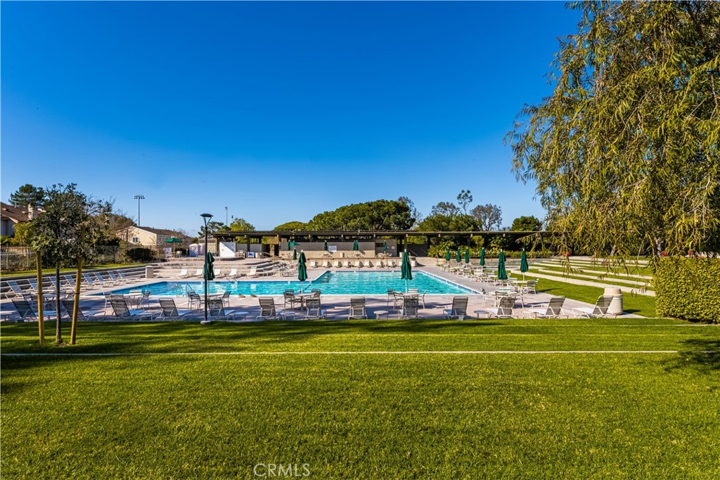4625 Green Tree Lane Irvine, CA 92612 - Photo 28 of 29 a view of a swimming pool with a yard