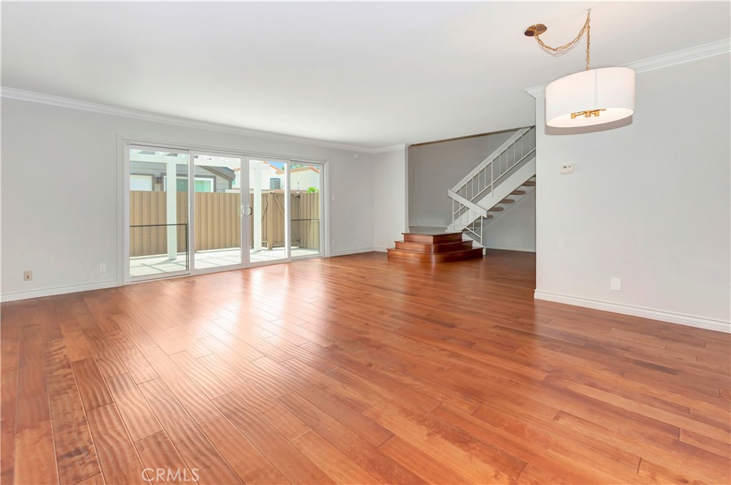 4625 Green Tree Lane Irvine, CA 92612 - Photo 5 of 29 a view of an empty room with wooden floor and a window