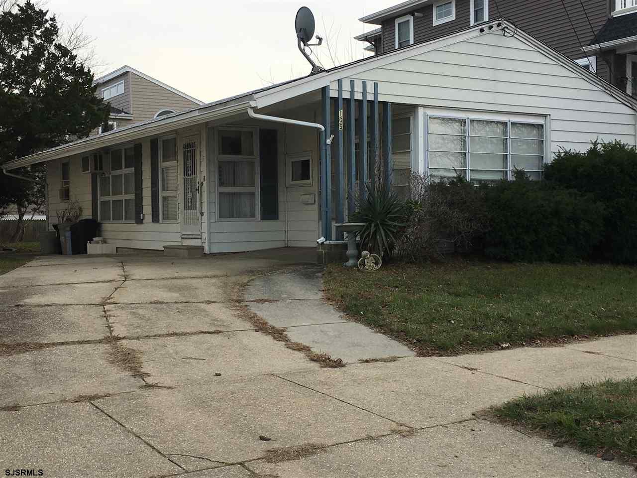 105 West Inlet Road Ocean City, NJ 08226 - Photo 1 of 1 a front view of a house with garden