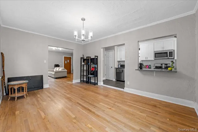 a view of a kitchen with furniture and a flat screen tv