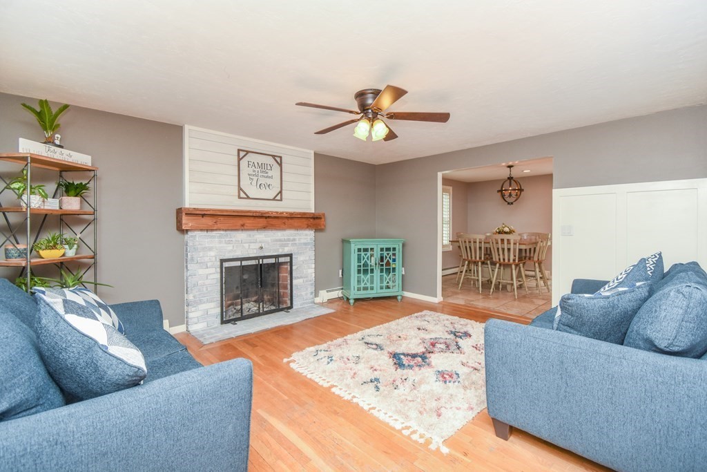 26 Rush Pond Road Lakeville, MA 02347 - Photo 17 of 38 a living room with furniture and a fireplace