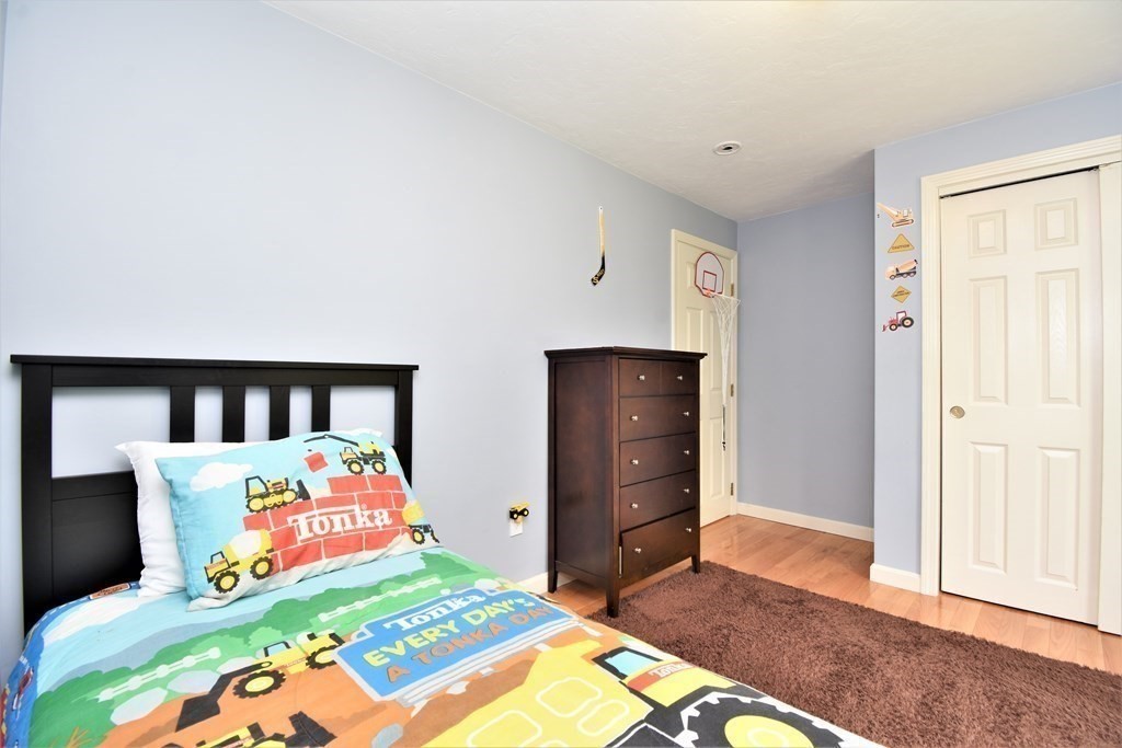 26 Rush Pond Road Lakeville, MA 02347 - Photo 20 of 38 a bedroom with a bed and a dresser
