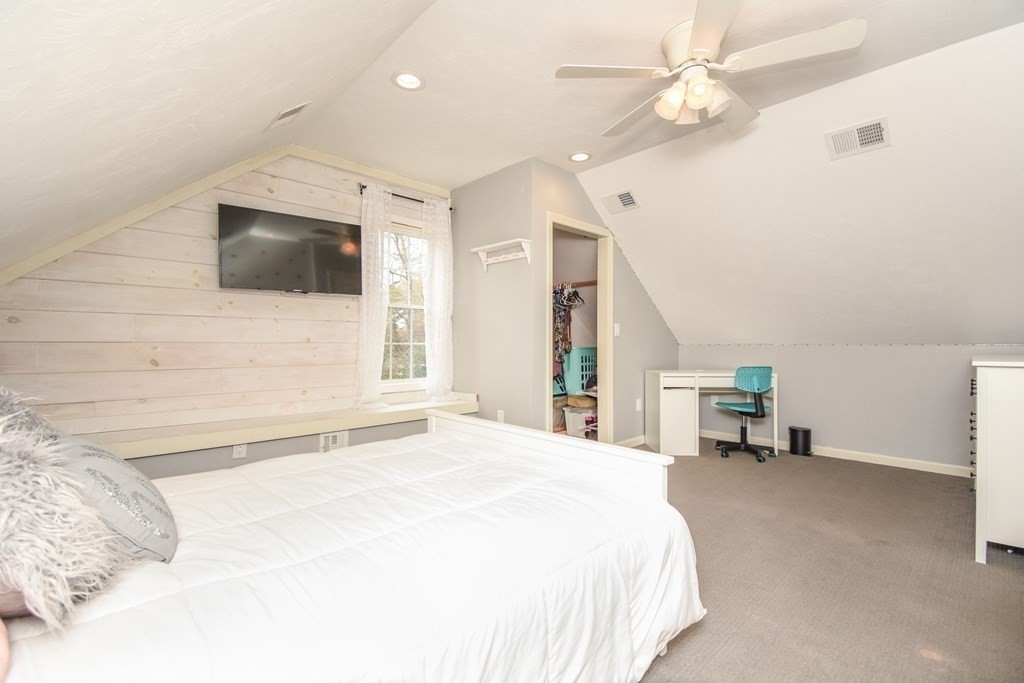 26 Rush Pond Road Lakeville, MA 02347 - Photo 25 of 38 a bedroom with a bed and a flat screen tv