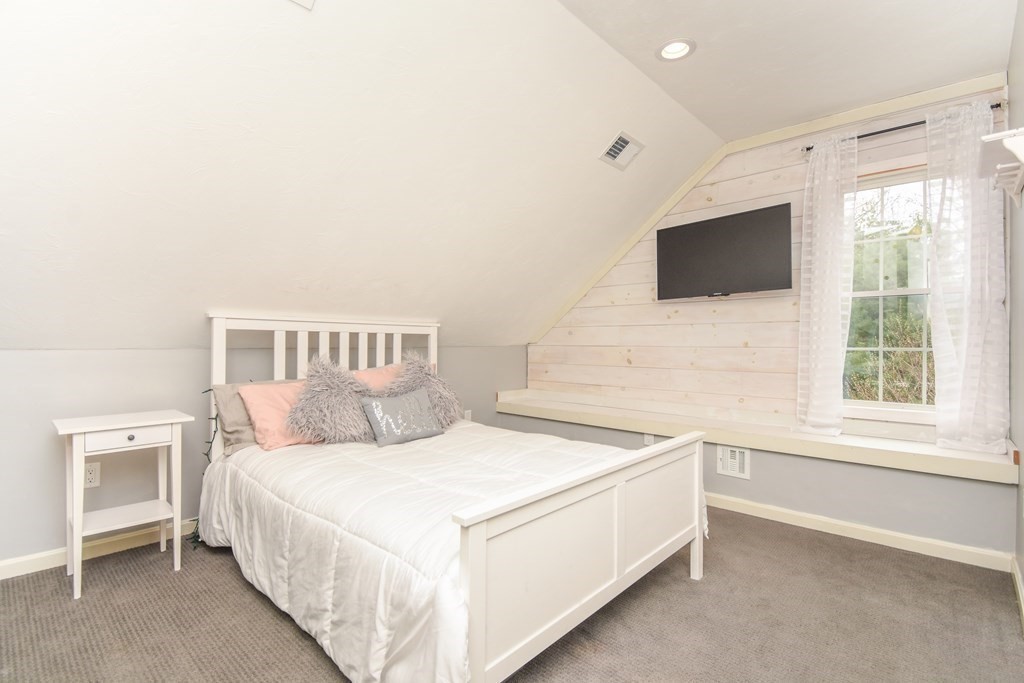 26 Rush Pond Road Lakeville, MA 02347 - Photo 26 of 38 a bedroom with a bed and a flat screen tv