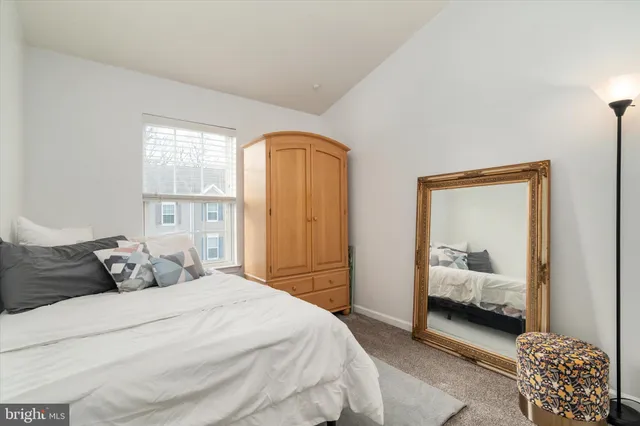 a bedroom with a bed and a chair