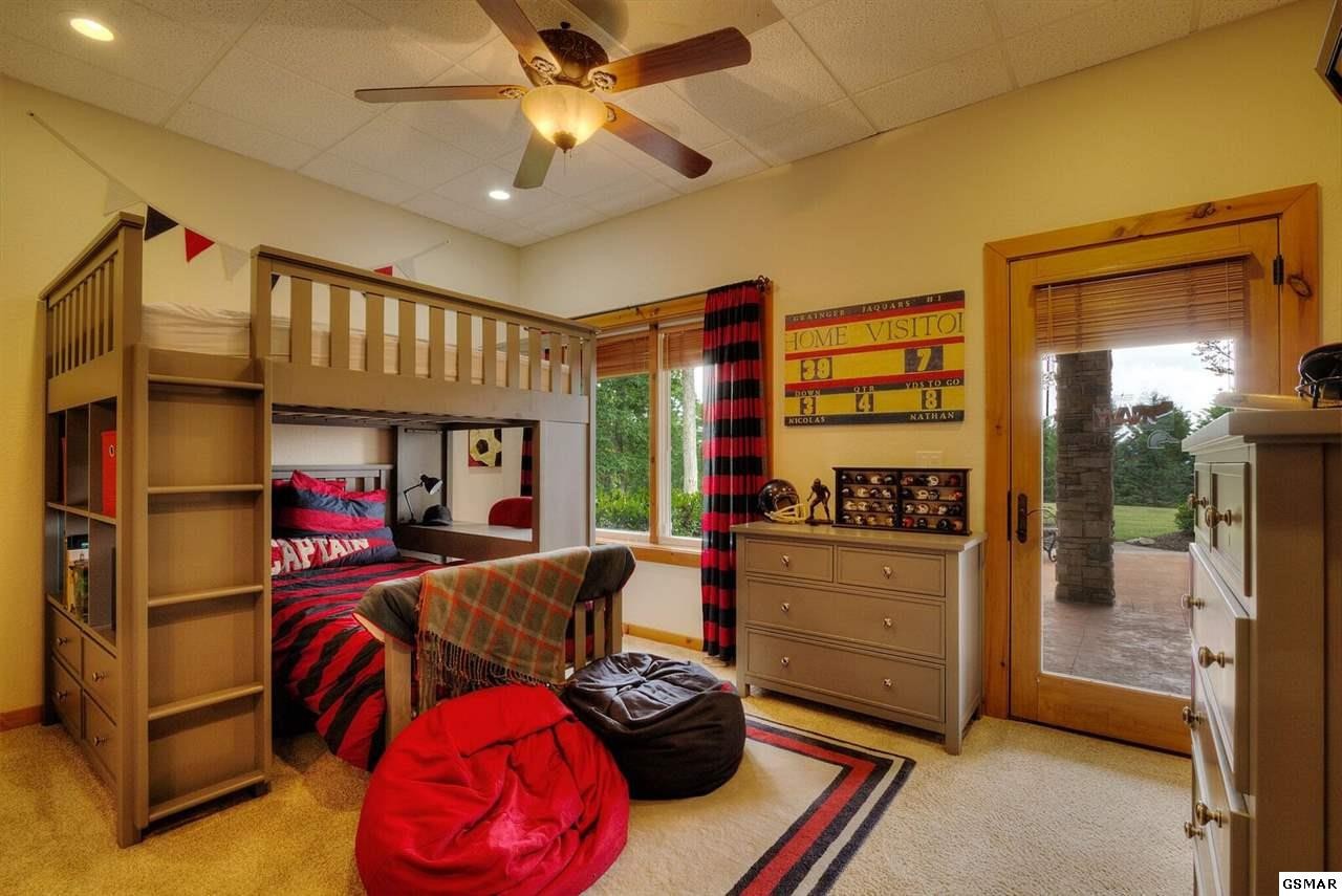 796 Deer Ridge Drive Rutledge, TN 37861 - Photo 24 of 35 a bedroom with furniture and a large window