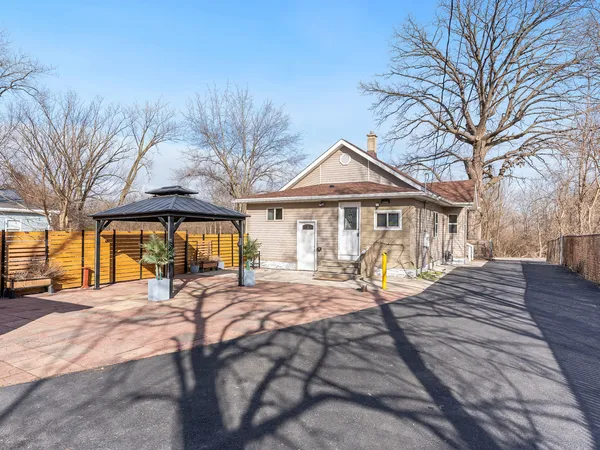 a view of a house with large outdoor space and porch