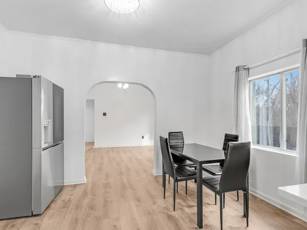 a kitchen with stainless steel appliances a sink stove and refrigerator