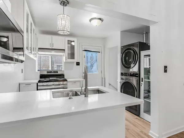 a kitchen with a sink and cabinets