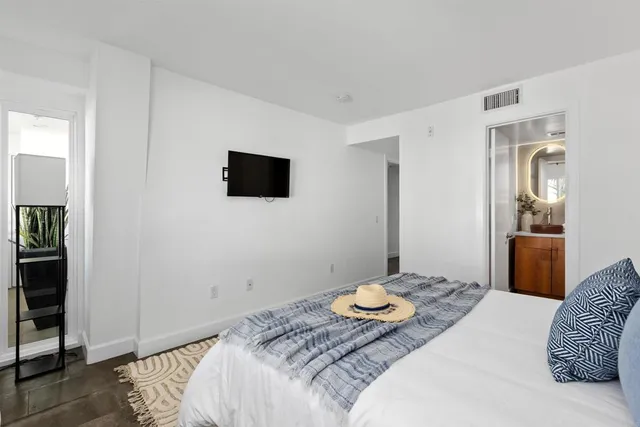 a bathroom with a double vanity sink and a mirror