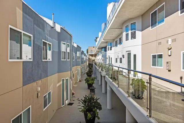 a view of a patio with wooden floor and outdoor seating