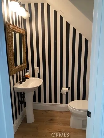 a view of a hallway with furniture