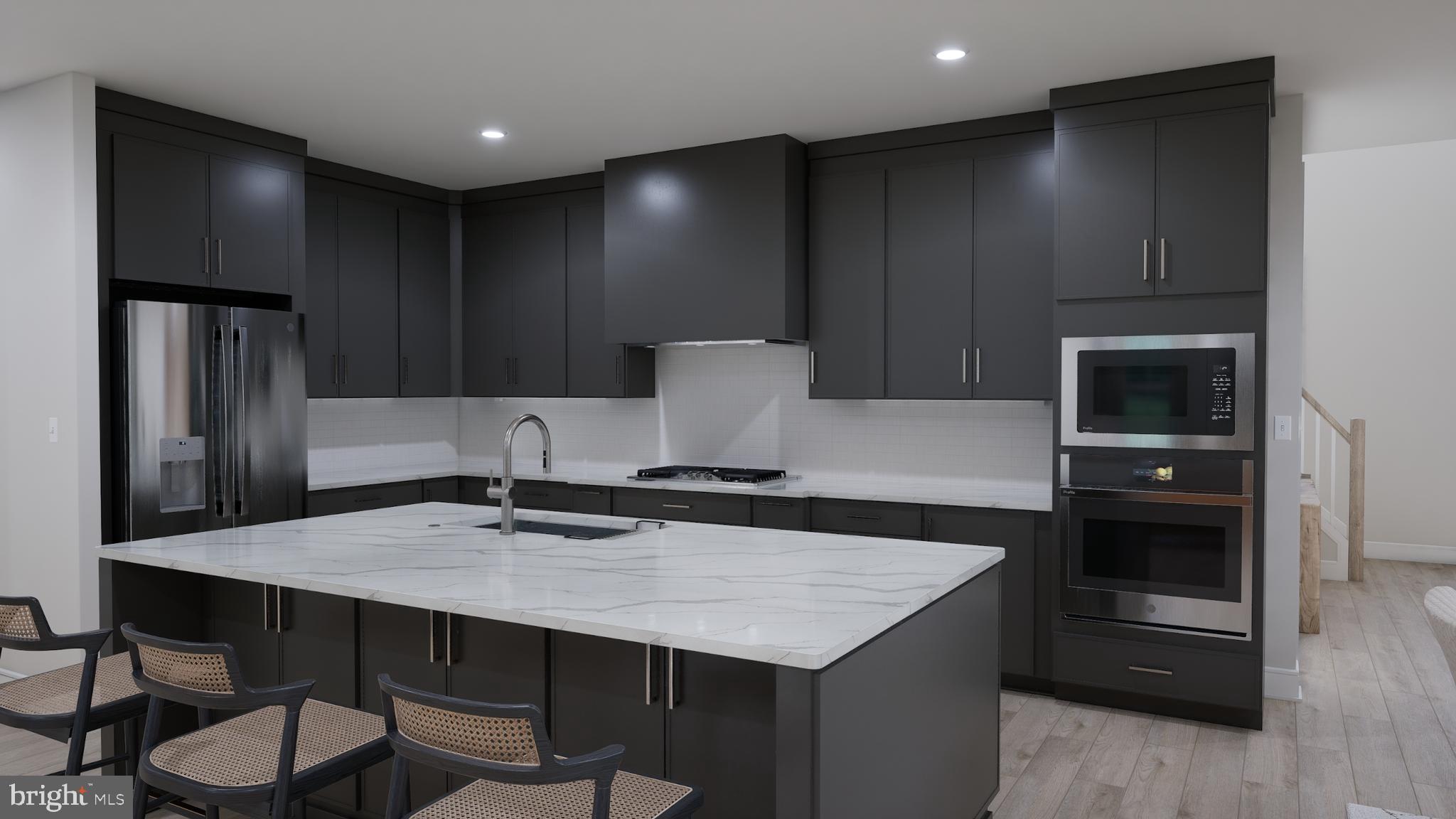 Orchard Grove, Unit STONE Brambleton, VA 20148 - Photo 16 of 53 a kitchen with a table and chairs in it