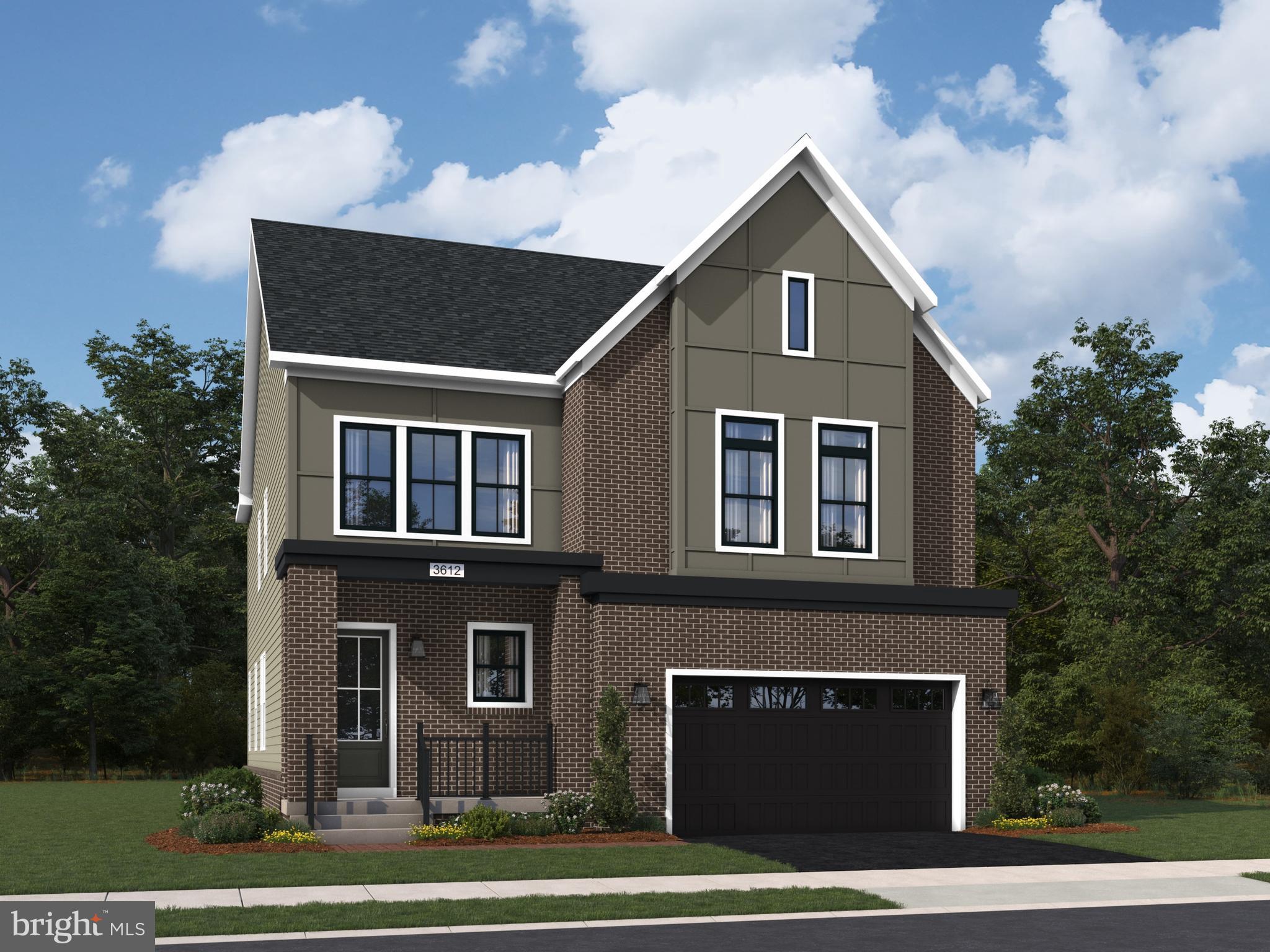 Orchard Grove, Unit STONE Brambleton, VA 20148 - Photo 3 of 53 a front view of a house with a yard and garage