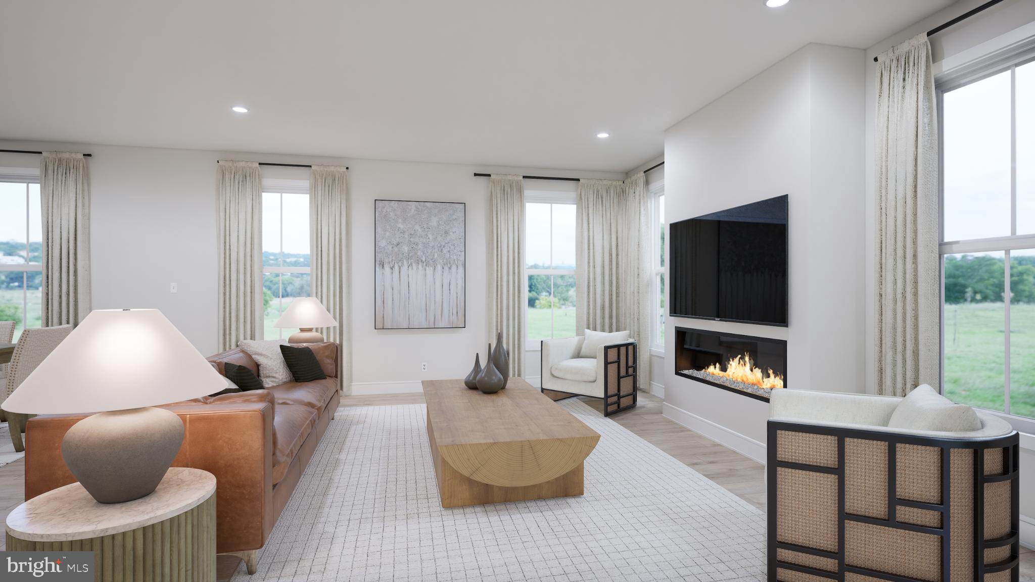 Orchard Grove, Unit STONE Brambleton, VA 20148 - Photo 33 of 53 a living room with furniture and a flat screen tv