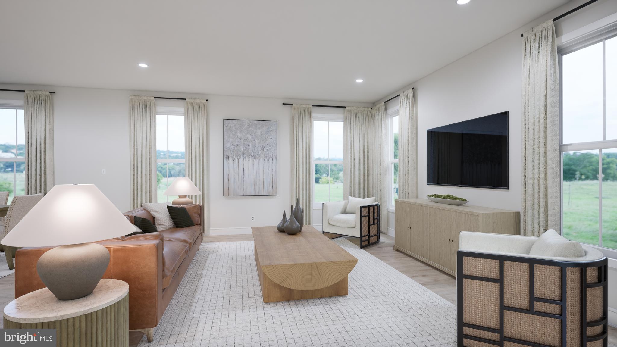 Orchard Grove, Unit STONE Brambleton, VA 20148 - Photo 41 of 53 a living room with furniture and a flat screen tv