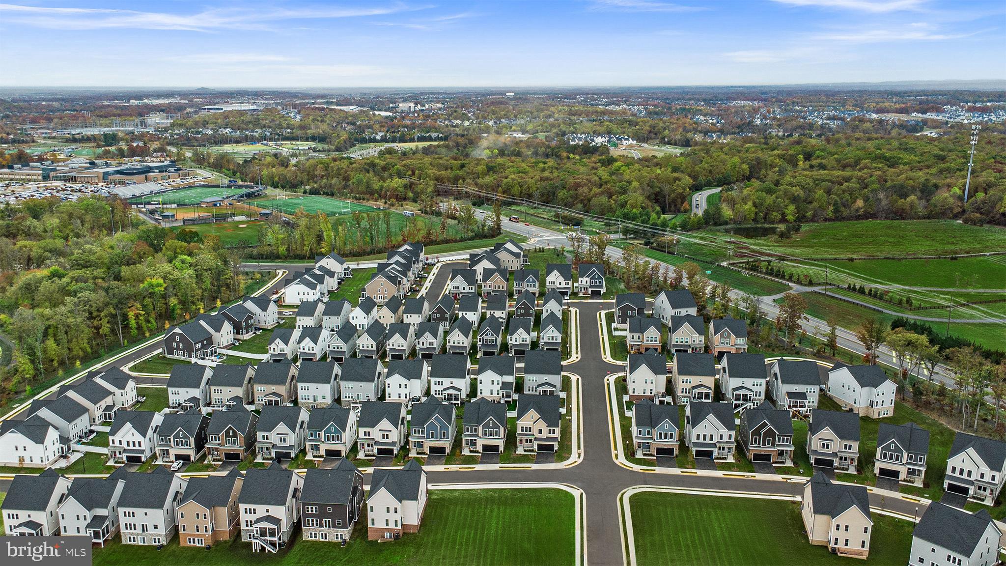 Orchard Grove, Unit STONE Brambleton, VA 20148 - Photo 50 of 53 a view of a city with tall buildings