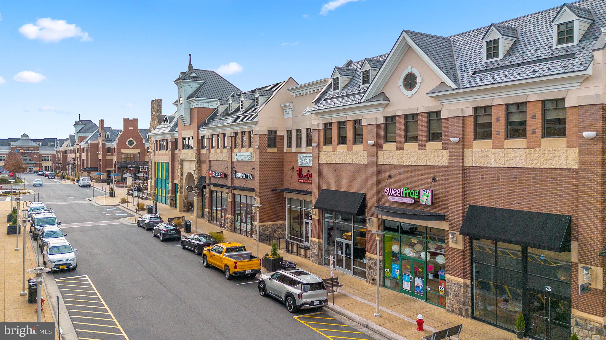 Orchard Grove, Unit STONE Brambleton, VA 20148 - Photo 52 of 53 a view of a street with cars