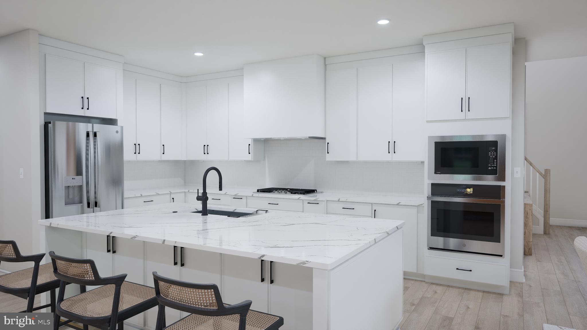 Orchard Grove, Unit STONE Brambleton, VA 20148 - Photo 8 of 53 a kitchen with stainless steel appliances granite countertop a sink stove and refrigerator