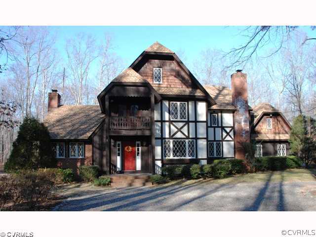 7434 Knightly Road Mechanicsville, VA 23116 - Photo 1 of 12 a front view of a house with yard and tree s