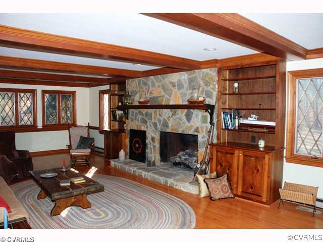 7434 Knightly Road Mechanicsville, VA 23116 - Photo 4 of 12 a living room with furniture a fireplace and a flat screen tv