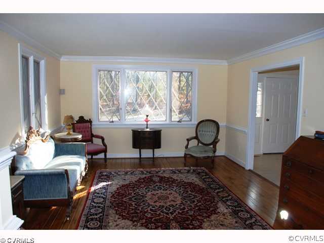 7434 Knightly Road Mechanicsville, VA 23116 - Photo 8 of 12 a living room with furniture a window and a table