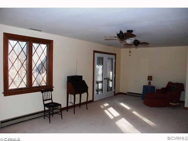 7434 Knightly Road Mechanicsville, VA 23116 - Photo 10 of 12 a living room with furniture and a window