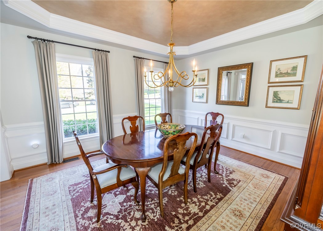 14506 Post Mill Drive Midlothian, VA 23113 - Photo 18 of 48 a view of a dining room with furniture window and wooden floor