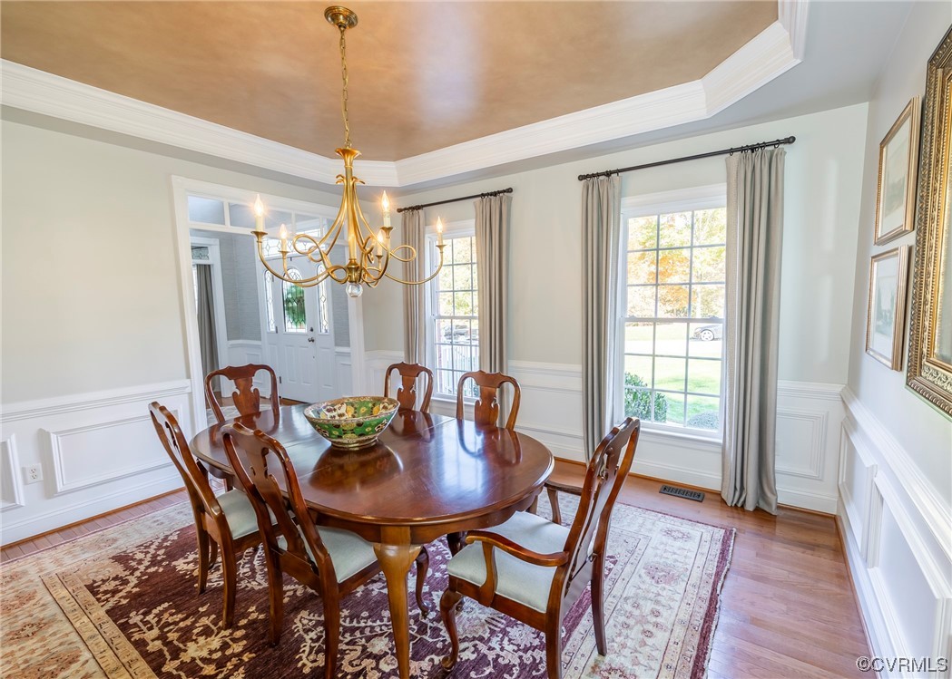 14506 Post Mill Drive Midlothian, VA 23113 - Photo 19 of 48 a dining room with furniture a chandelier and wooden floor