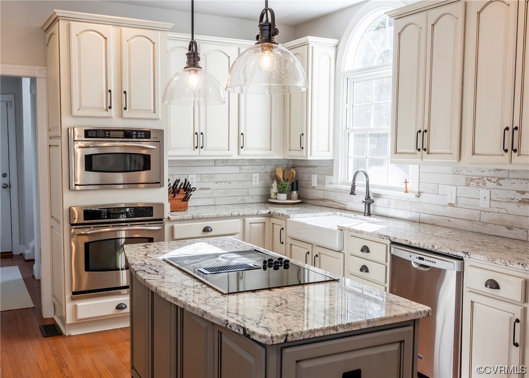 14506 Post Mill Drive Midlothian, VA 23113 - Photo 22 of 48 a kitchen with granite countertop a sink stainless steel appliances and white cabinets