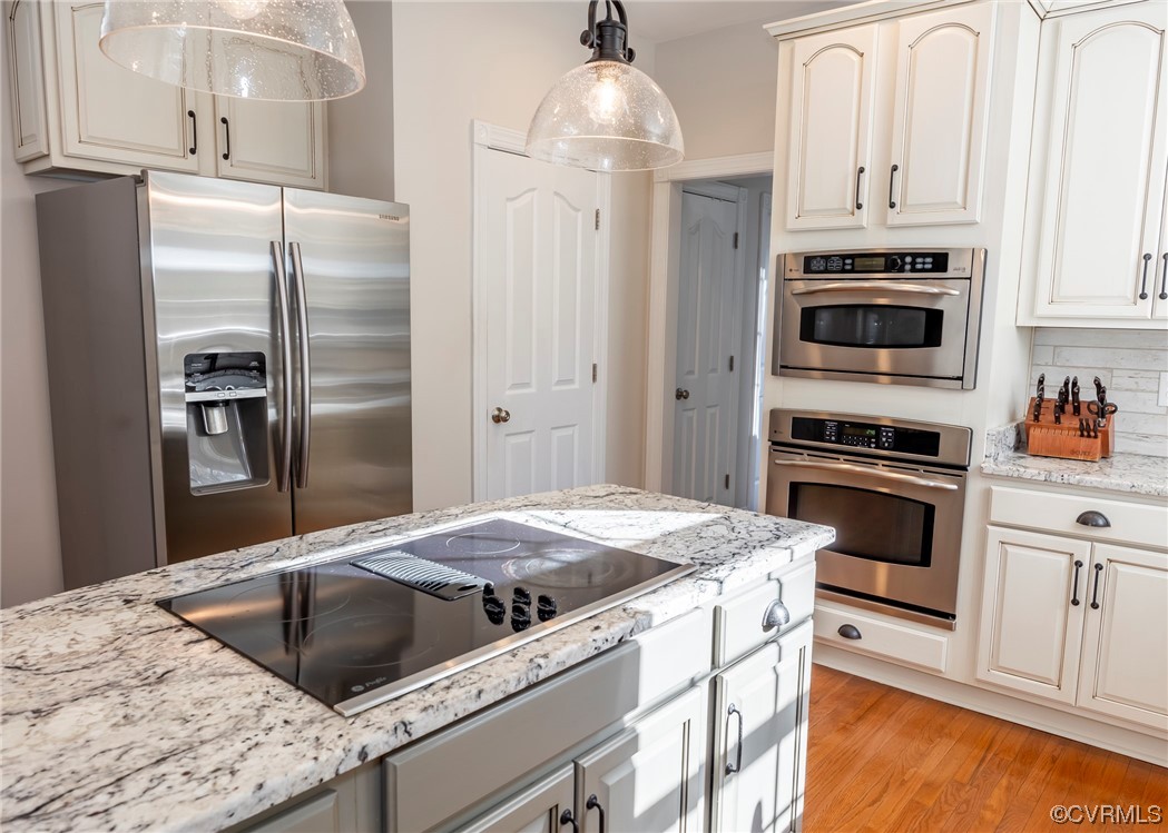14506 Post Mill Drive Midlothian, VA 23113 - Photo 26 of 48 a kitchen with granite countertop white cabinets and stainless steel appliances
